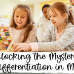 alt="2 young girls sitting at a table exploring an abacus together as a representation of differentiation in math?'
